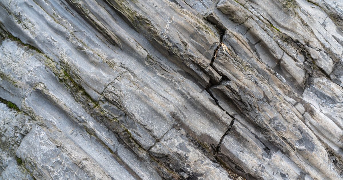 Close-up of tilted layers of gray rock